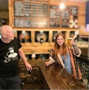 The pine bar with casks on the stillage behind it